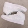 AJ 1 Mid ‘Triple White Patent’ BQ6472-100 AJ 1 Mid ‘Triple White Patent’ BQ6472-100