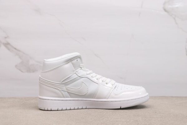 AJ 1 Mid ‘Triple White Patent’ BQ6472-100 AJ 1 Mid ‘Triple White Patent’ BQ6472-100