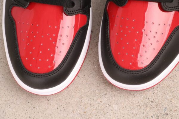 AJ 1 Mid ‘Patent Bred Toe’ HV4091-006 AJ 1 Mid ‘Patent Bred Toe’ HV4091-006