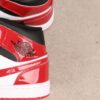 AJ 1 Mid ‘Patent Bred Toe’ HV4091-006 AJ 1 Mid ‘Patent Bred Toe’ HV4091-006